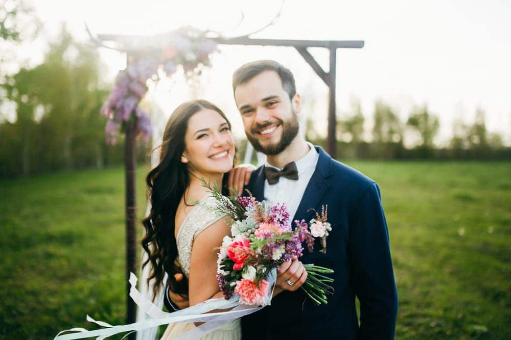 Bride and Groom posing whilst smiling